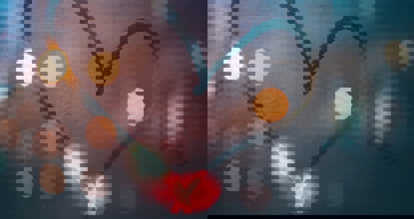 Ett hjärta och kulörta lampor. Foto.