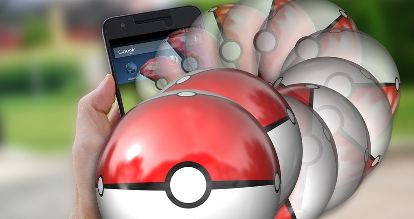 Mobilskärm med Pokémon bollar. Foto.