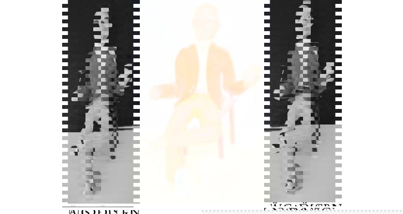 Bokomslag med en läkarfigur gjord i lera. Illustration.