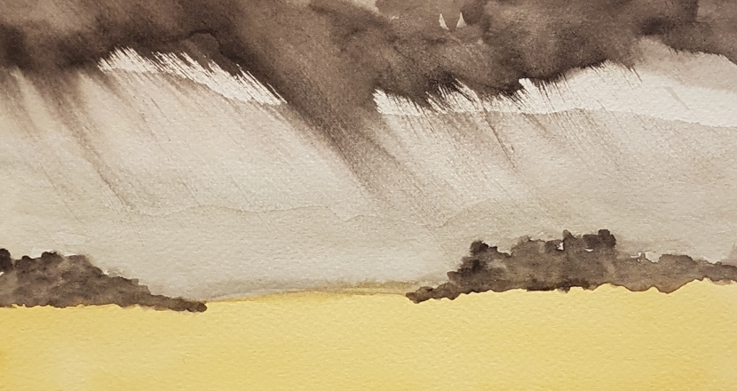 Ett landskap i brunt, gult och beige där färgerna flyter i varandra. Foto.