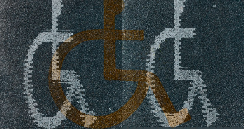 Symbolen för handikapparkering. Foto.