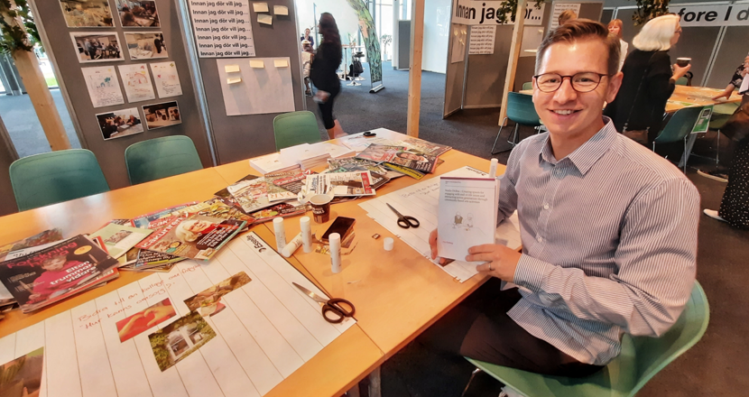 Max vid ett pysselbord med veckotidningar, sax och klister. Foto.