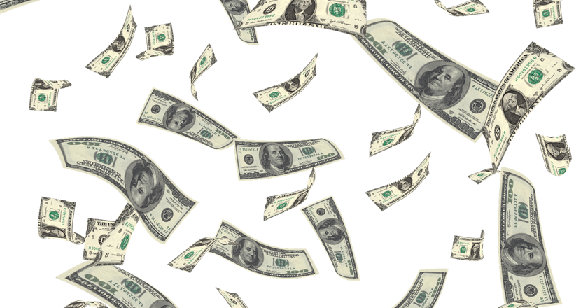 Dollarsedlar som fladdrar iväg. Foto.