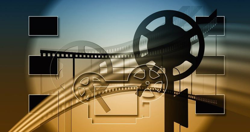 Filmrutor och en projektor i blått och sandgult. Illustration.