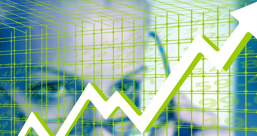 En kurva som pekar uppåt, med ett ansikte på en person som tar på sig ett par glasögon bakom. Foto.